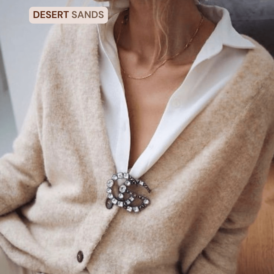 Ivory and Taupe Outfit Colour Combo for Minimal Winter Style_1. a beautiful plush cardigan worn with a white blouse and a Gucci broach