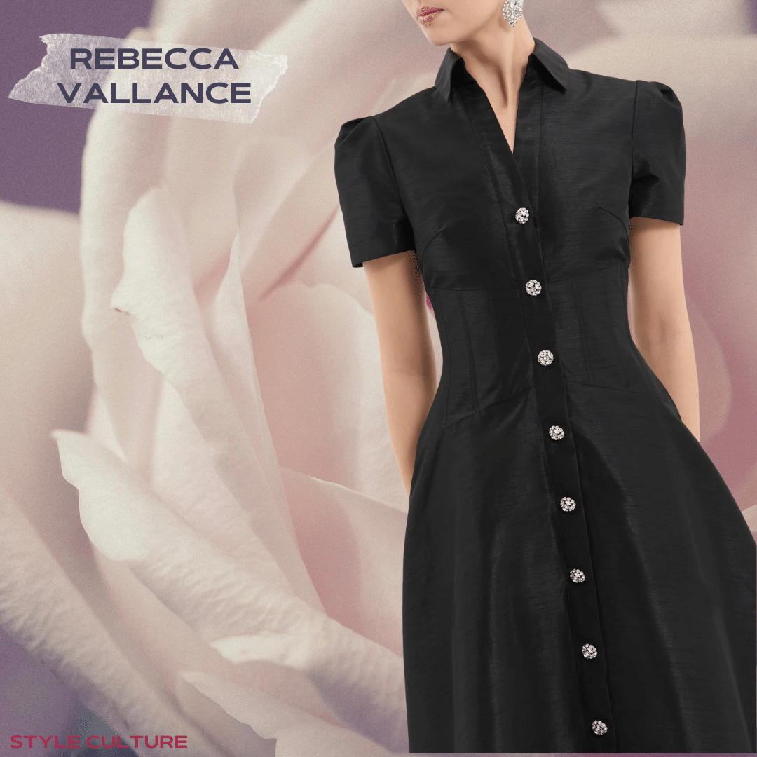 Rebecca Vallance black dress, featuring a short sleeve and diamante button details featured on a rose pink flower backdrop