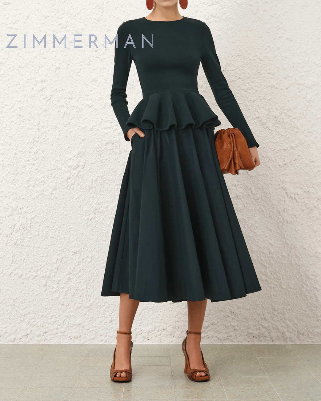 Zimmermann dark green midi skirt featuring a full, voluminous silhouette, styled with a matching fitted top.